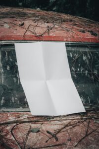 a white piece of paper stuck inside a car